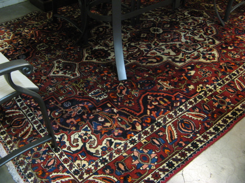 Appraisal: PERSIAN BAKHTIAR CARPET floral and central floral medallion type with