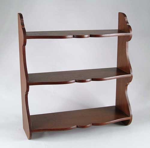 Appraisal: FINE WALNUT GRADUATED HANGING SHELF Fine American form having three