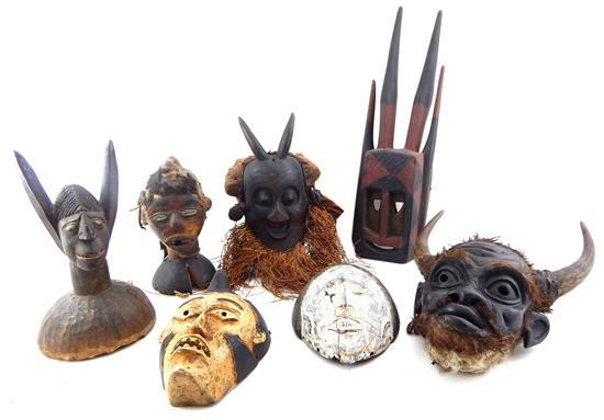 Appraisal: TRIBAL Seven carved African masks and carvings Salampasu headdress depicting