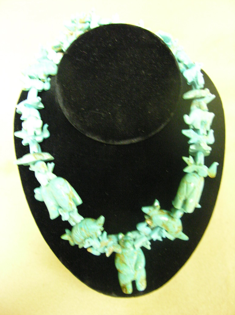 Appraisal: CARVED TURQUOISE FETISH NECKLACE Bear Beaver Rabbits Fox Birds Armadillos