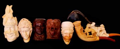 Appraisal: Four Meerschaum figural pipesTwo of African women both in fitted