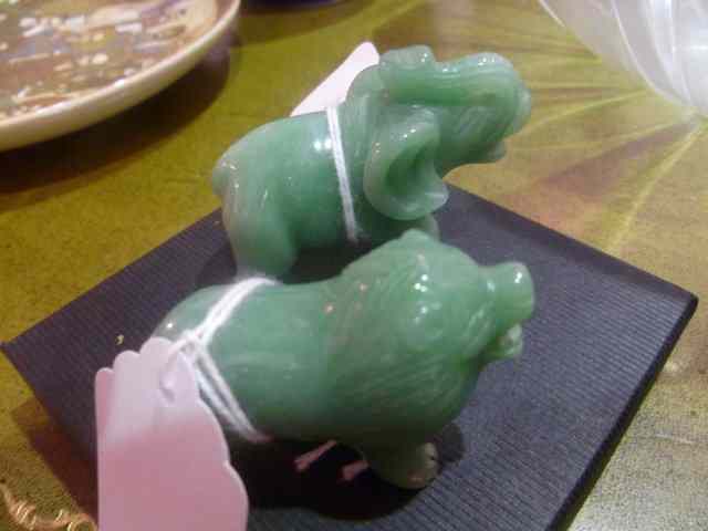 Appraisal: TWO JADEITE SMALL CARVED ANIMALS an elephant and a lion