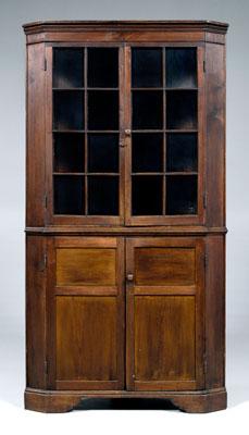 Appraisal: North Carolina walnut corner cupboard walnut with yellow pine lower