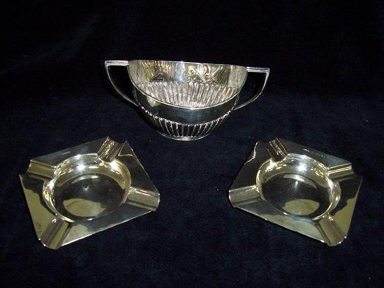 Appraisal: A pair of ashtrays of canted square shape marked I