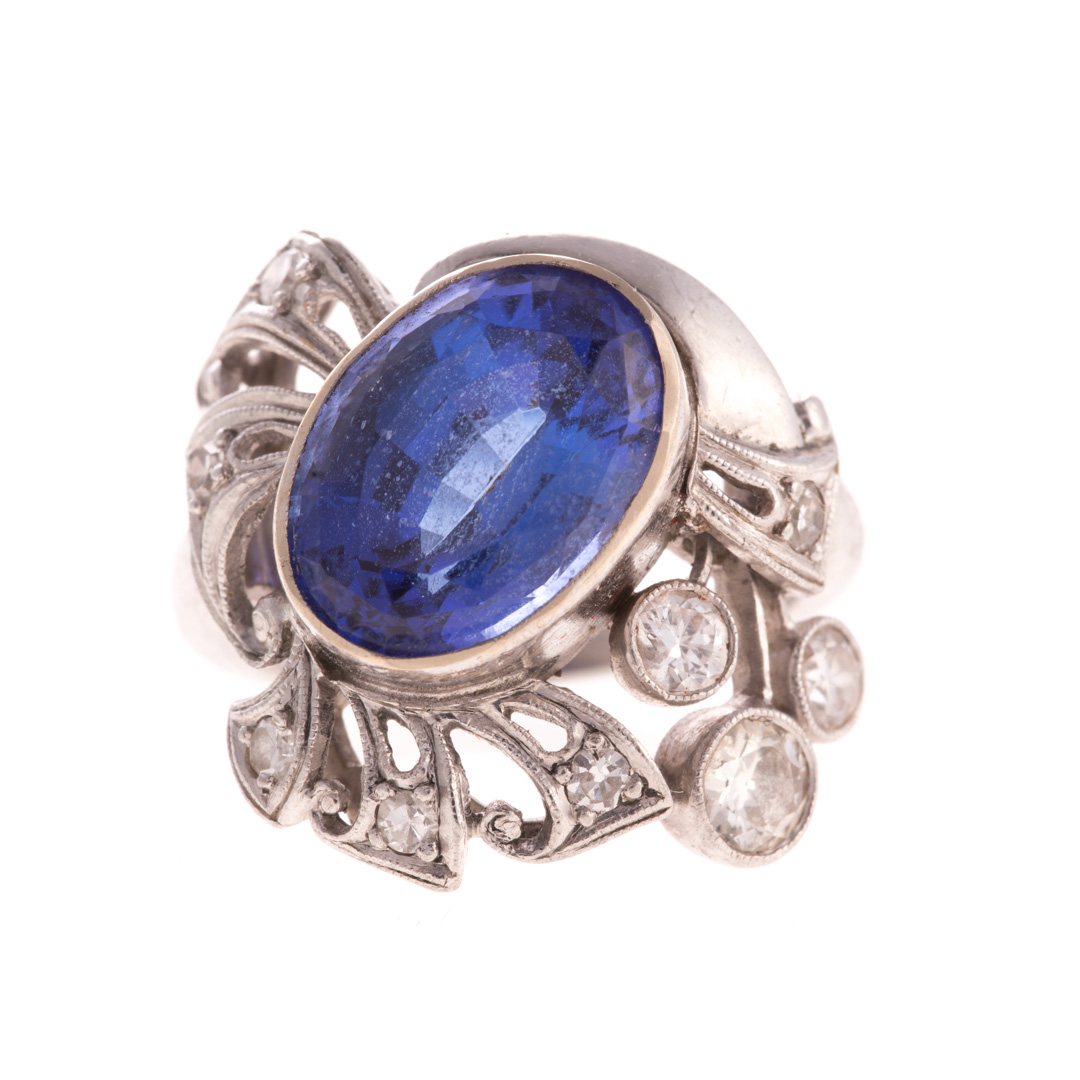 Appraisal: A Platinum Tanzanite and Diamond Ring Platinum ring featuring an