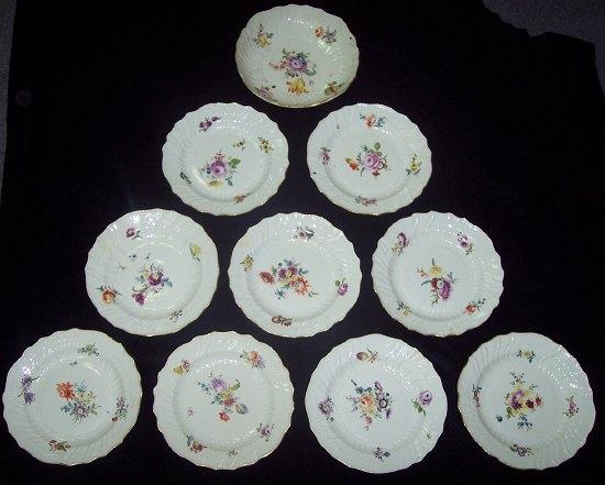 Appraisal: Nine Meissen dessert plates with moulded flutes and basket edges