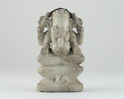 Appraisal: An Indian stone figure of Ganesh the elephant god seated