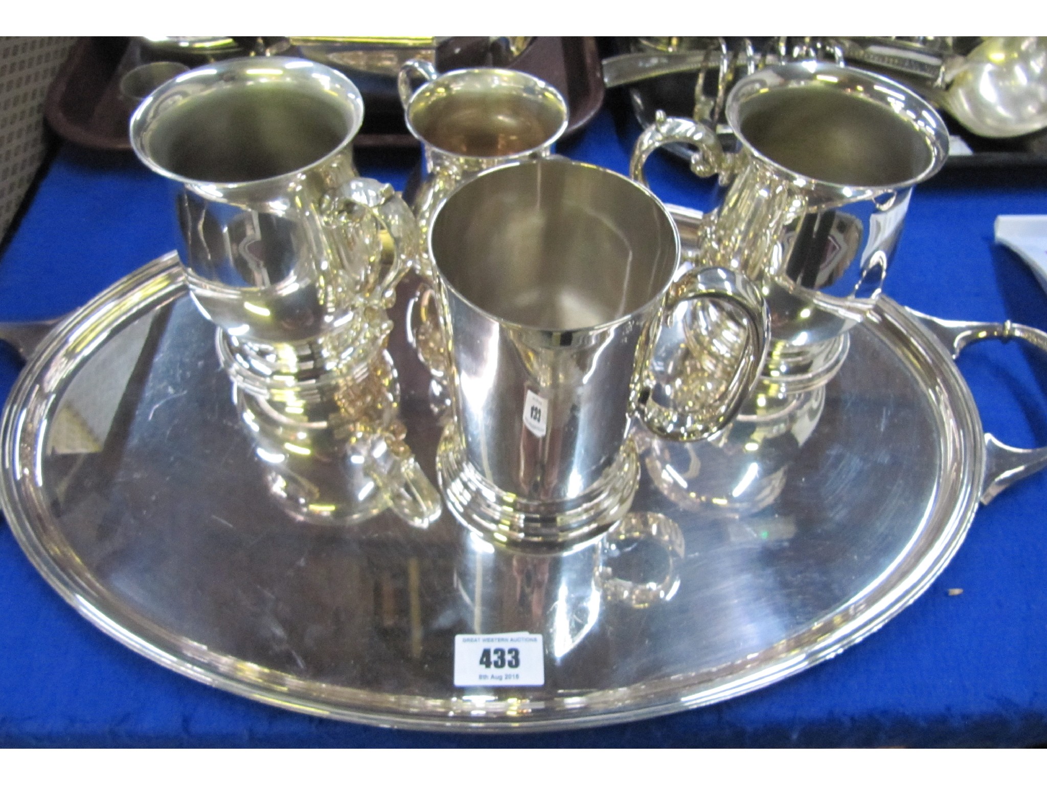 Appraisal: A lot comprising an EP serving tray and four tankards