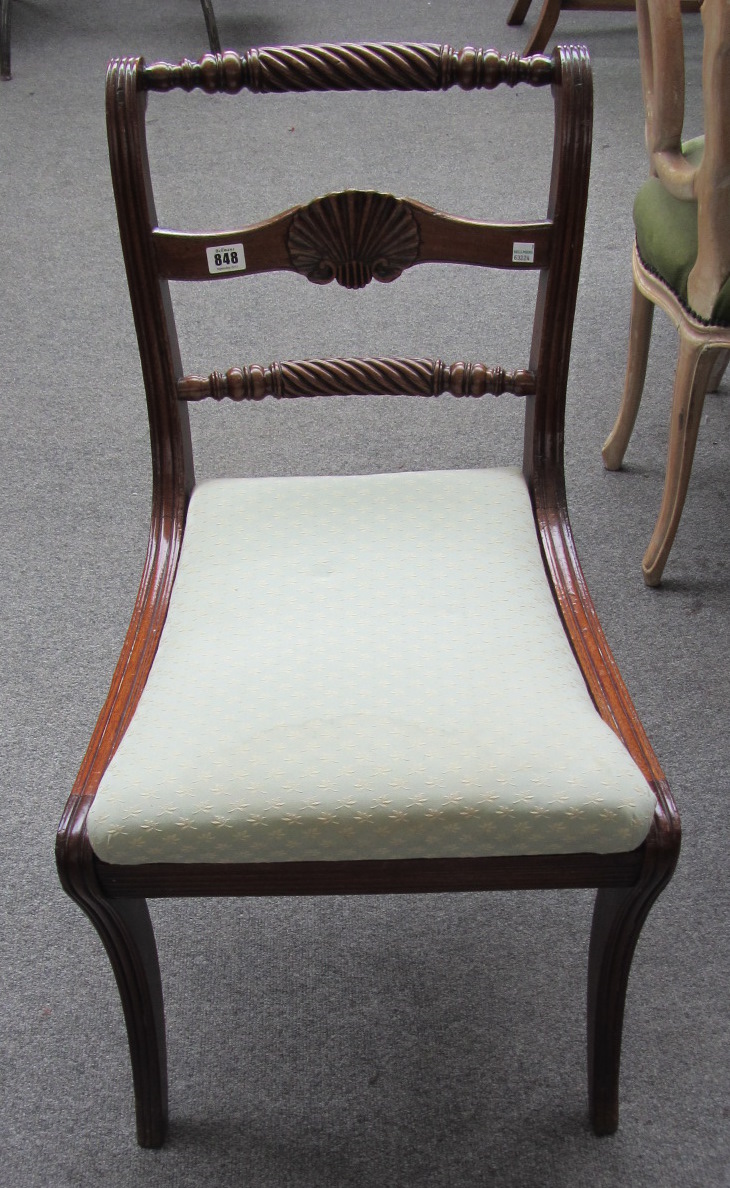 Appraisal: A pair of Regency mahogany dining chairs with shell and