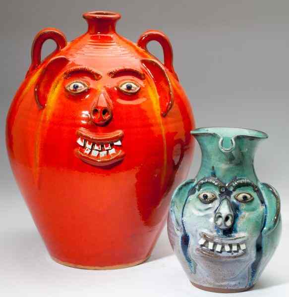 Appraisal: NC Pottery Two A V Smith Face Jugsthe first an