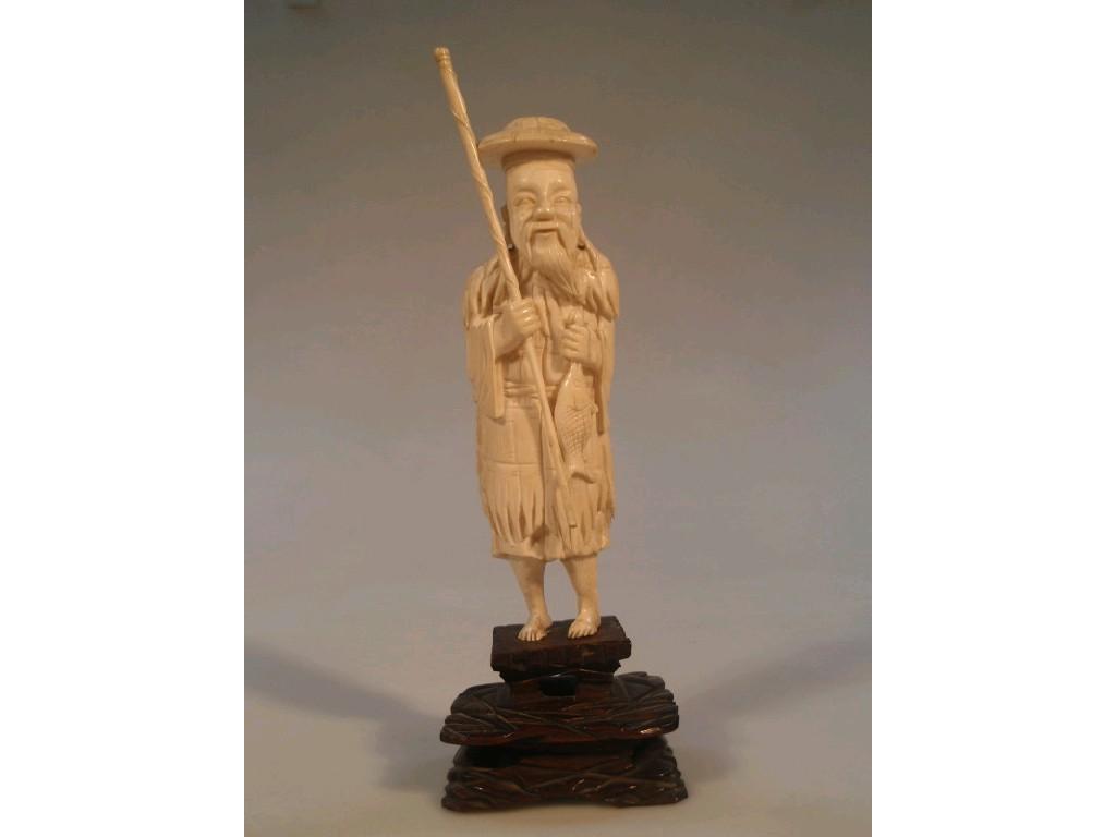 Appraisal: An early thC Chinese ivory figure carved as a fisherman