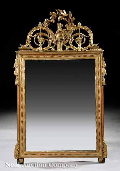 Appraisal: An Antique Louis XVI-Style Carved Giltwood Mirror scrolling foliate crest