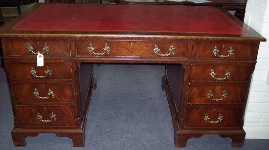 Appraisal: A mahogany pedestal desk fitted drawers to one side and