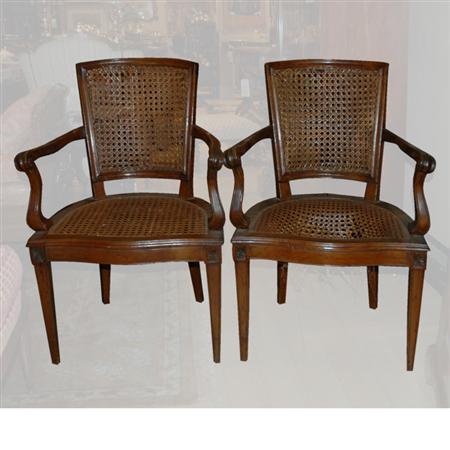 Appraisal: Pair of Italian Neoclassical Style Walnut and Caned Armchairs Estimate