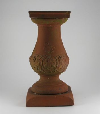 Appraisal: A terracotta sun dial base moulded in relief with unmarked