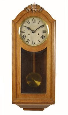 Appraisal: An oak cased wall clock with a twin barrel movement