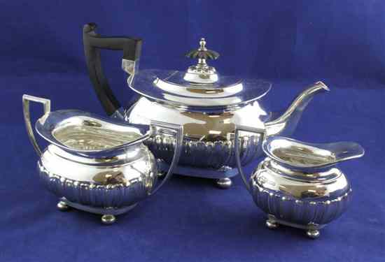 Appraisal: A George V demi fluted silver three piece tea set