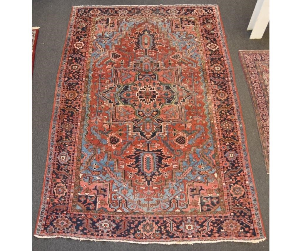 Appraisal: Antique room size Heriz-Karaja carpet with center geometric medallion tomato