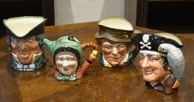 Appraisal: A Beswick ware Mask teapot and coverand three Royal Doulton