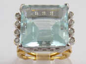 Appraisal: A yellow metal tests carat gold aquamarine and diamond ring