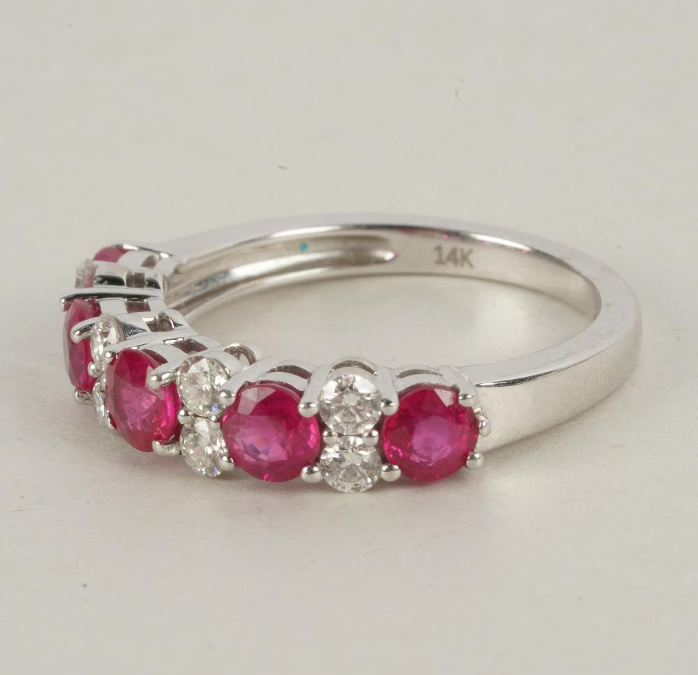 Appraisal: KARAT WHITE GOLD DIAMOND SYNTHETIC RUBY RINGcontaining five round synthetic