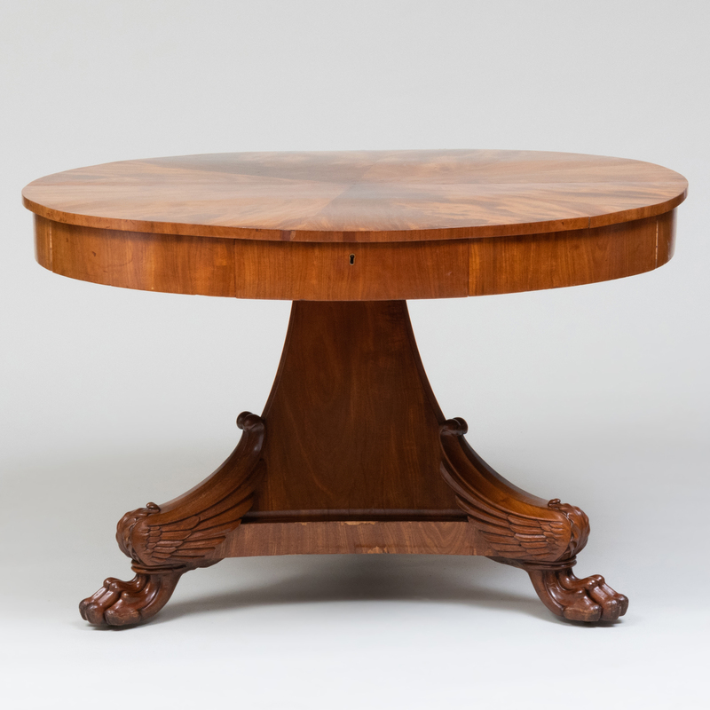 Appraisal: CONTINENTAL WALNUT CENTER TABLE Fitted with drawers and raised on