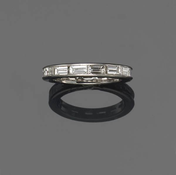 Appraisal: A diamond and platinum eternity band estimated total diamond weight