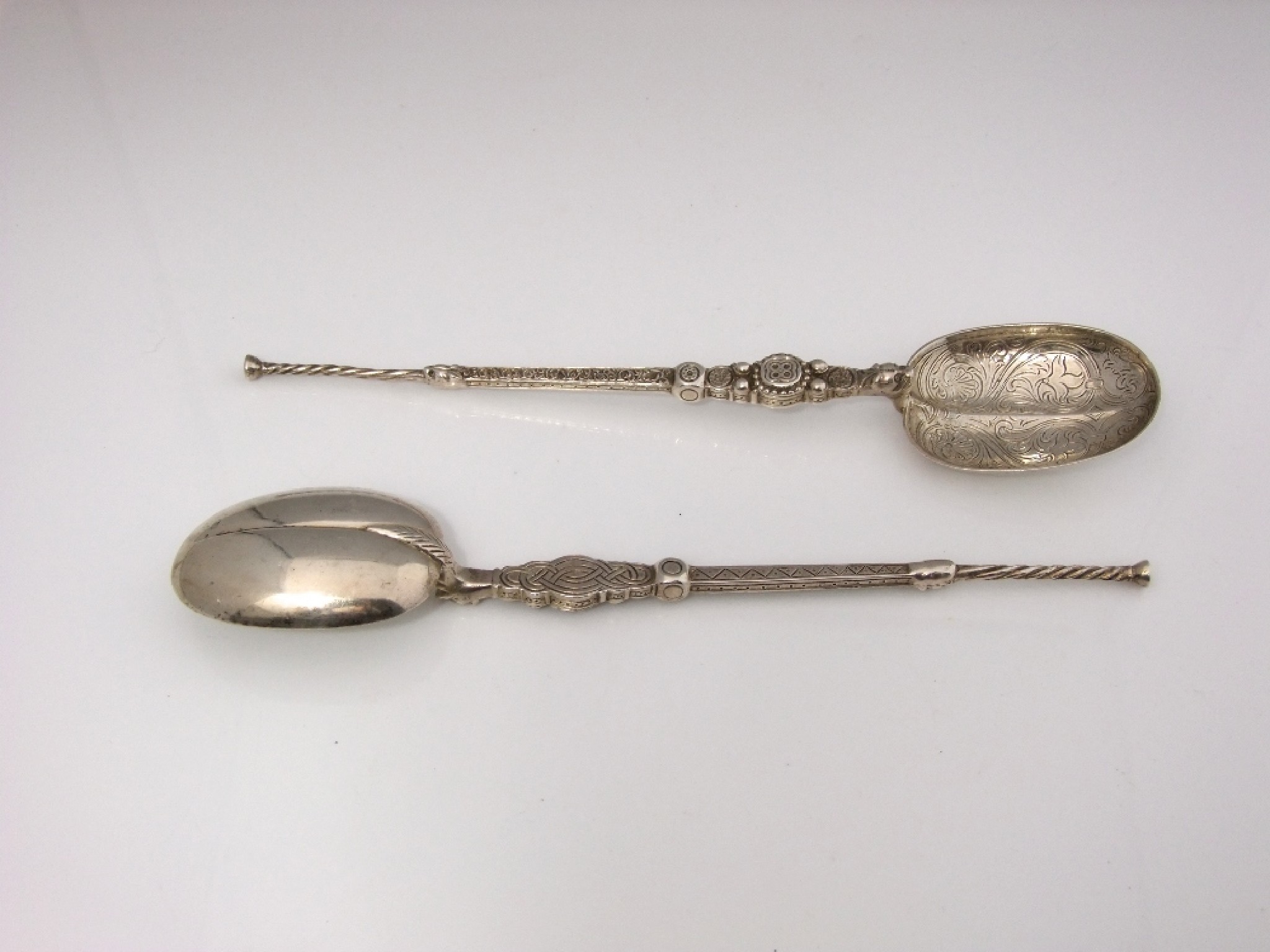 Appraisal: A pair of cast serving spoons in the form of