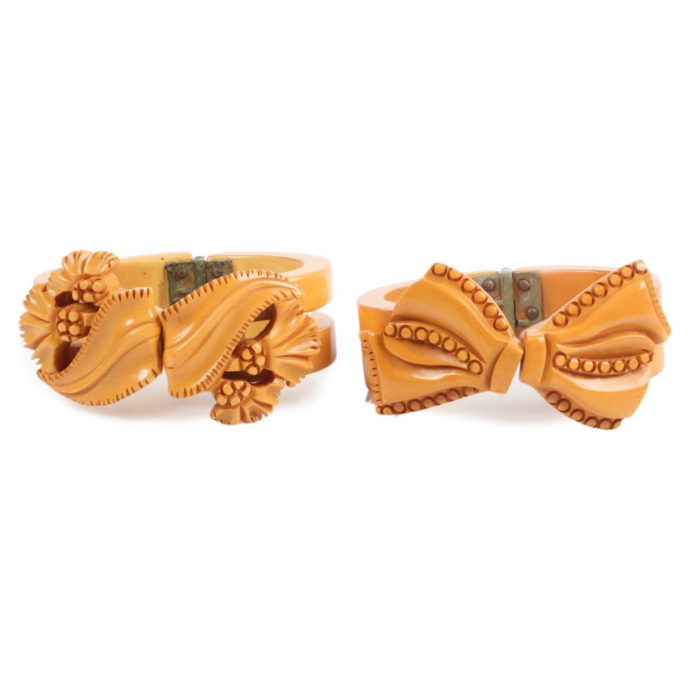 Appraisal: TWO BAKELITE BUTTERSCOTCH CARVED RIBBON CLAMPER BRACELETS INNER DIM WTwo