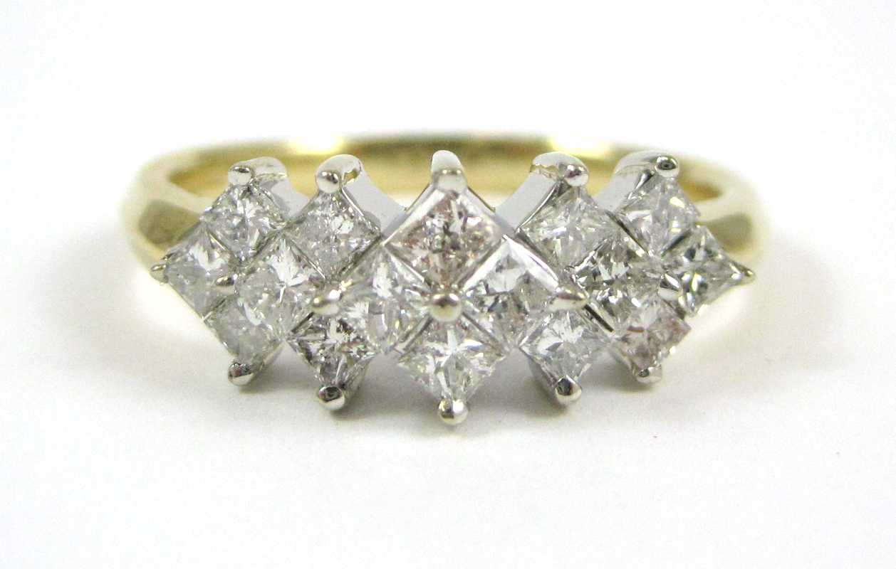 Appraisal: DIAMOND AND FOURTEEN KARAT GOLD RING The yellow and white