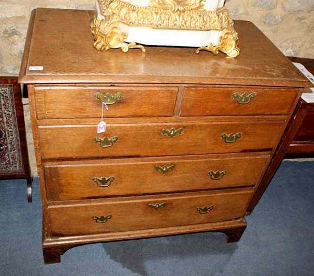 Appraisal: A GEORGE III OAK CHEST of two short and three