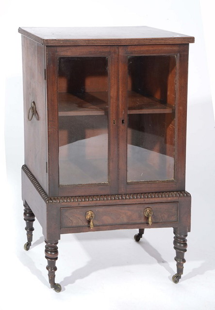 Appraisal: A REGENCY MAHOGANY SMALL GLAZED CABINET with single shelf enclosed