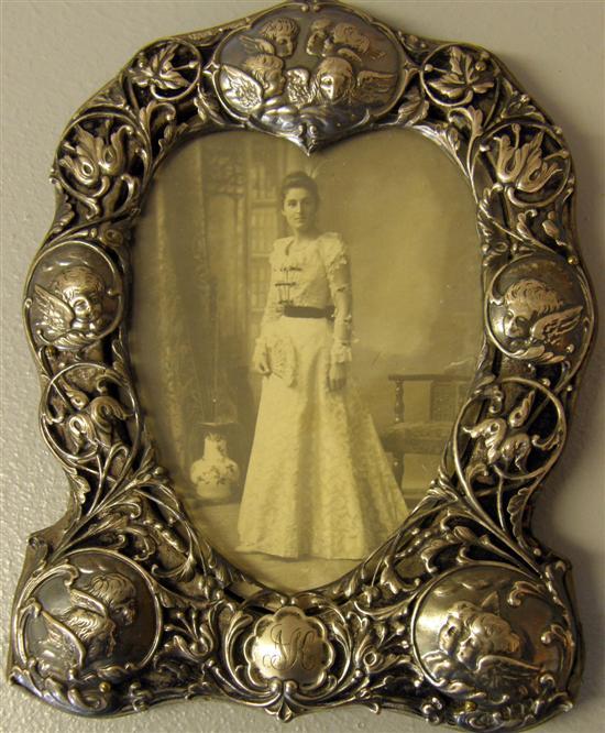 Appraisal: Late Victorian early Edwardian silver photograph frame with pierced scrolling