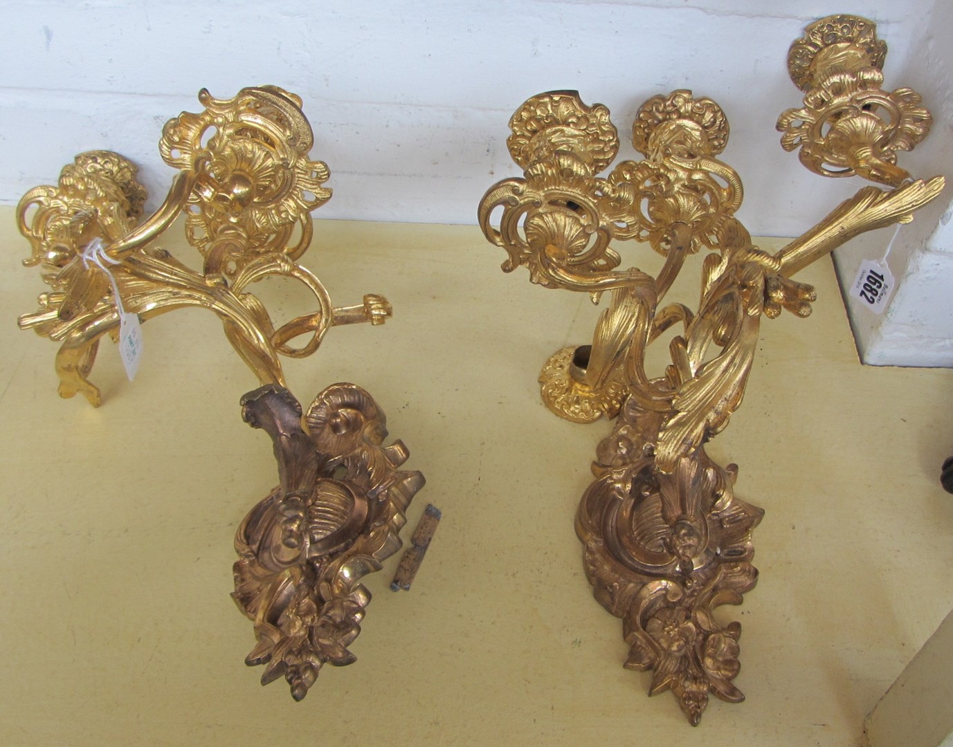 Appraisal: A pair of gilt bronze three light wall appliques late