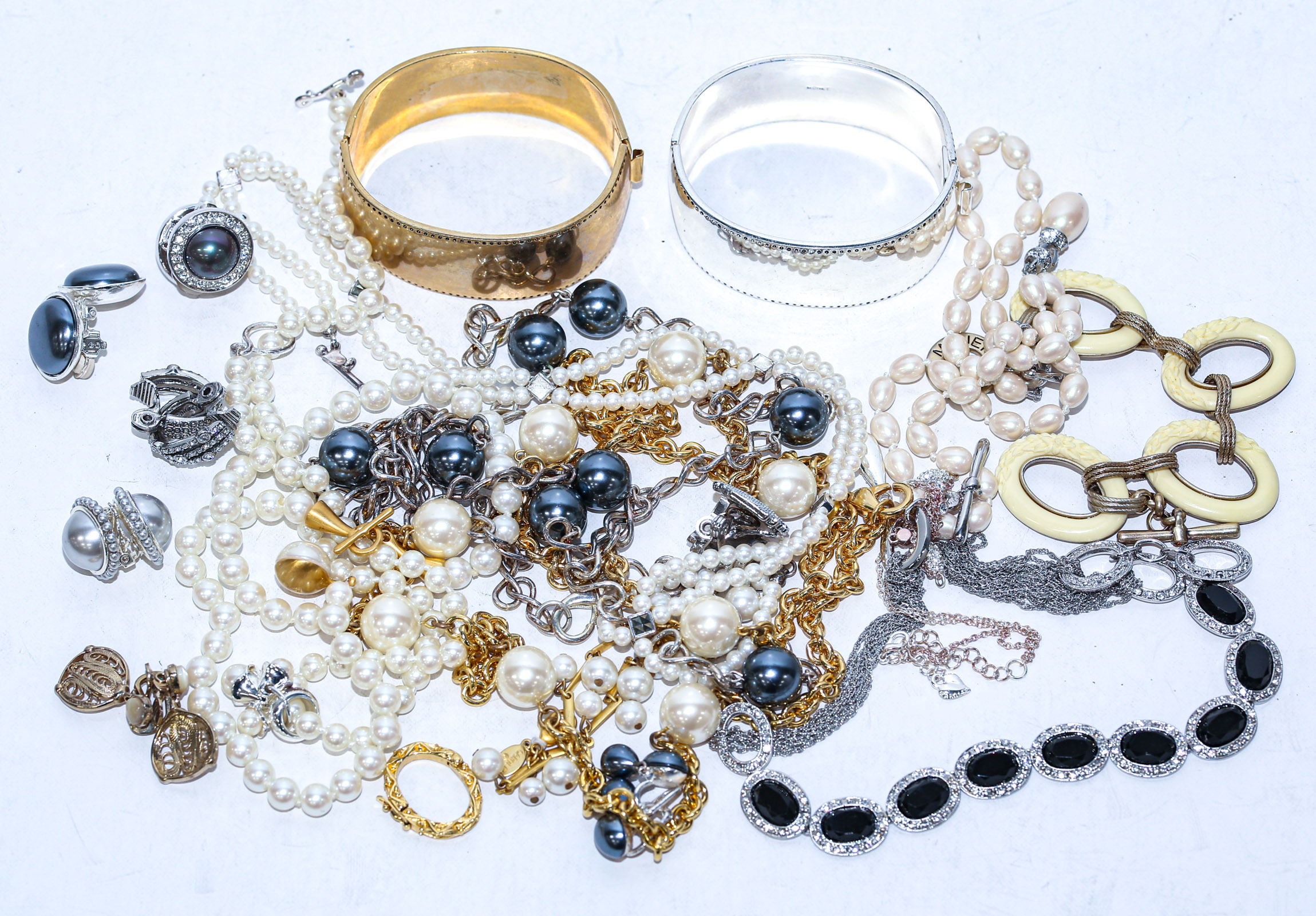 Appraisal: A COLLECTION OF COSTUME JEWELRY Including two wide bangles pearls