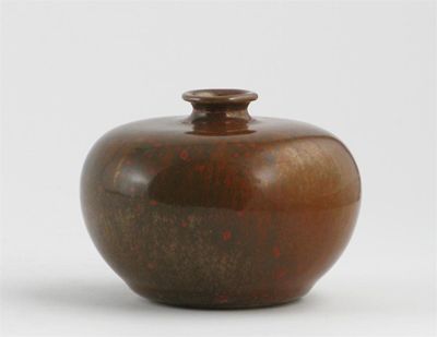 Appraisal: A small Chinese vase with a copper and olive green