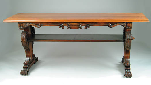 Appraisal: OUTSTANDING CARVED LIBRARY TABLE Circa Trestle type table has extensively