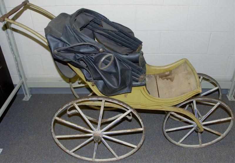 Appraisal: Antique Baby Carriage Antique baby carriage with wooden wheels and