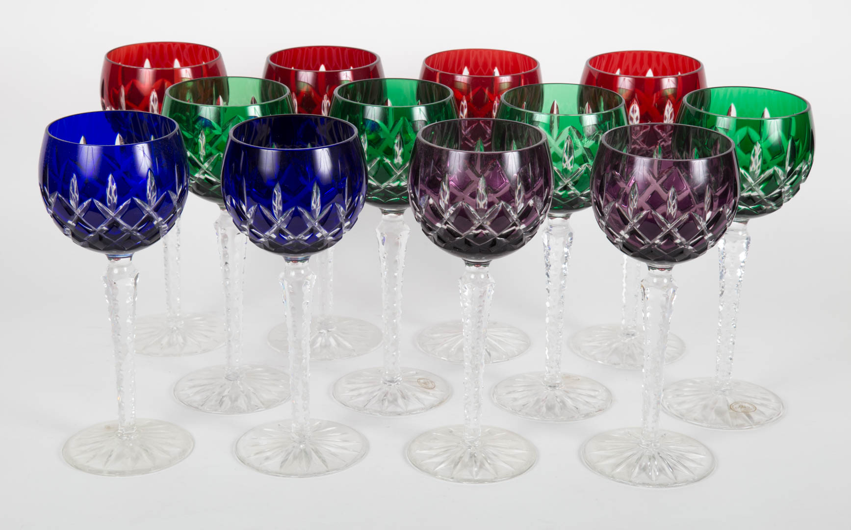 Appraisal: Twelve Czecho-Bohemian crystal wine stems colored cut-to-clear in H Condition