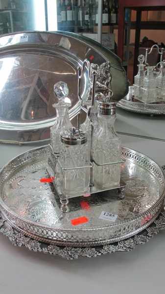 Appraisal: TWO SILVER PLATE TRAYS AND FOUR PIECE CRUET SET ONE