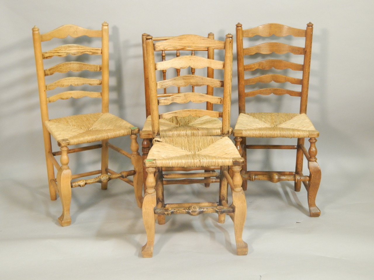 Appraisal: A set of three thC ladderback dining chairs each with