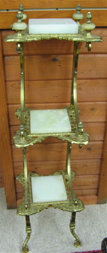 Appraisal: VICTORIAN STYLE BRASS WHAT-NOT STAND American th century having three