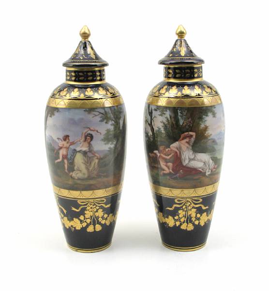 Appraisal: A pair of Vienna style porcelain covered vases height in