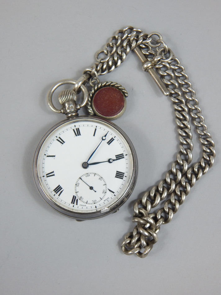 Appraisal: A silver pocket watch and chain the pocket watch with