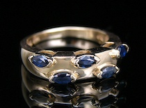 Appraisal: A Yellow Gold Ring Set With Five Sapphires A yellow