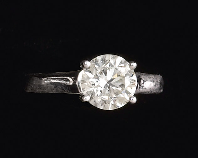 Appraisal: DIAMOND SOLITAIRE RING Platinum solitaire diamond ring set with one