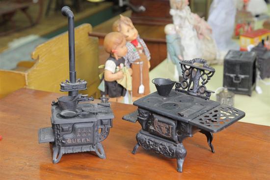 Appraisal: TWO TOY STOVES Both are cast iron with black paint