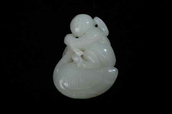 Appraisal: CHINESE CELADON JADE FIGURAL GROUP OF CHILD AND MANDARIN DUCK