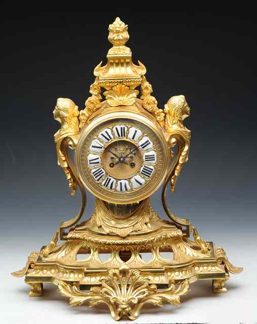 Appraisal: A FRENCH ORMOLU MANTEL CLOCK the two piece gilt dial