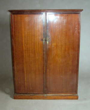 Appraisal: A mahogany compactum wardrobe early th century the cornice above